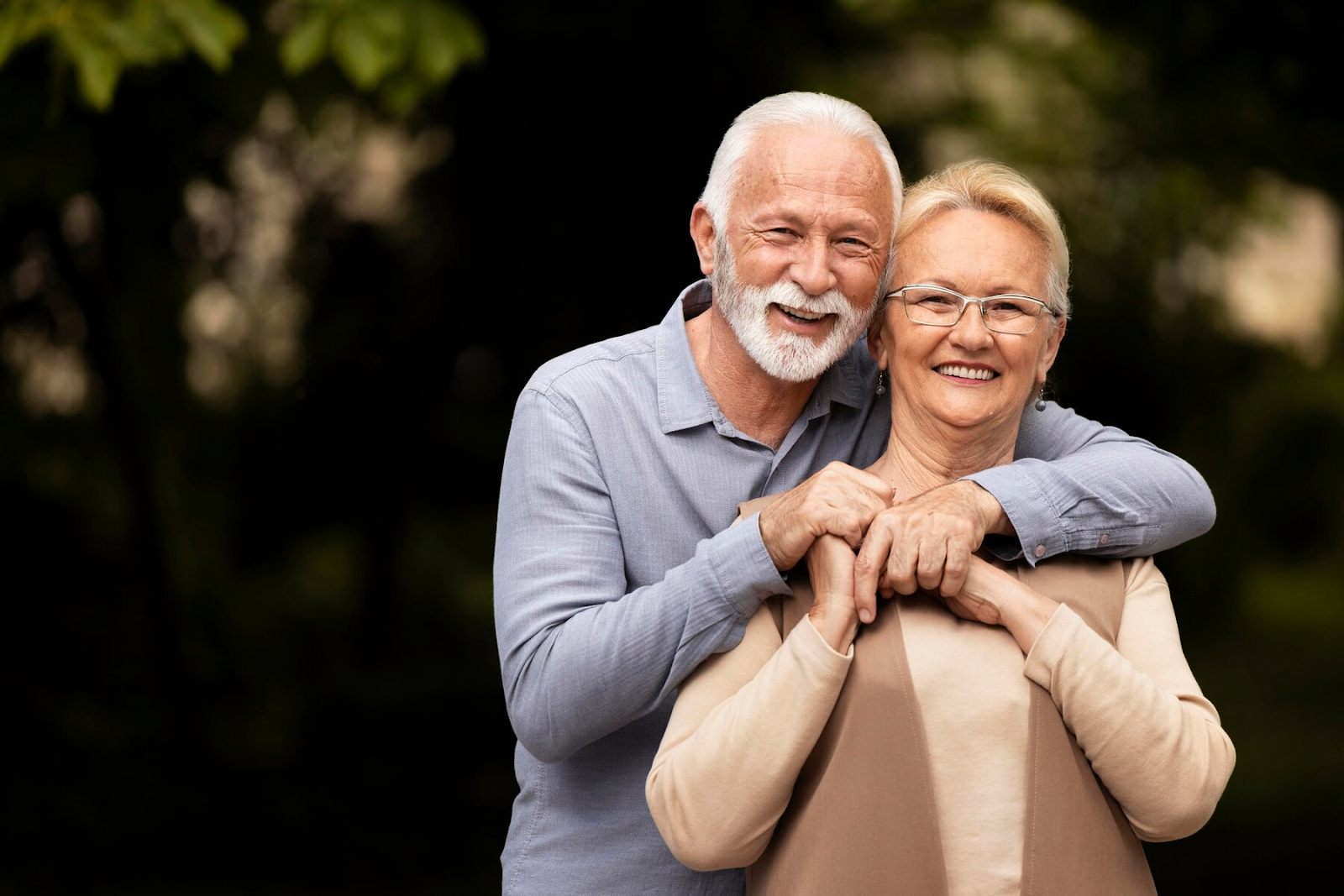 Senior couple smiling in a photo.