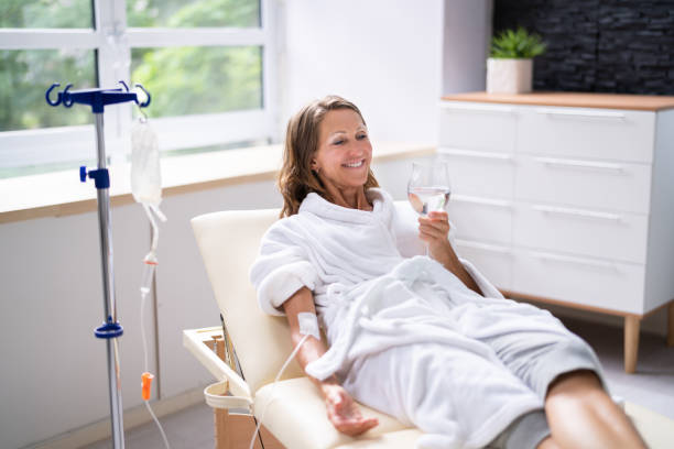 A woman relaxes during an IV therapy treatment.