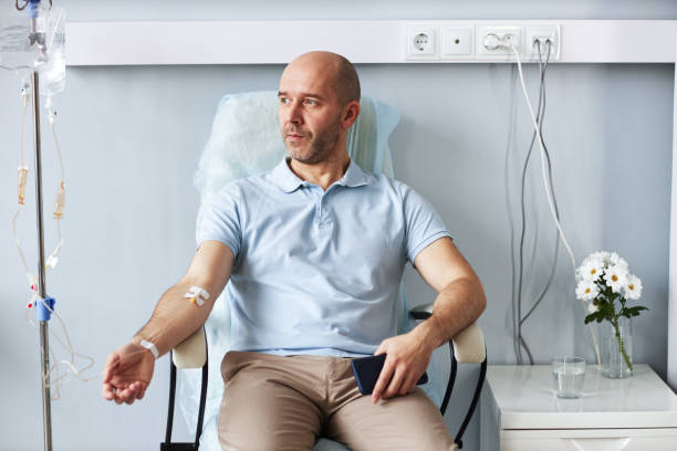 A man sits comfortably in a chair while receiving Nootropic IV therapy treatment.